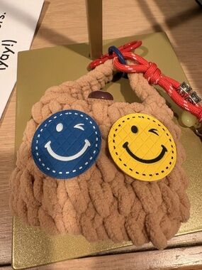 Plush crocheted bag charm with Blue and Yellow Smiley Charms
